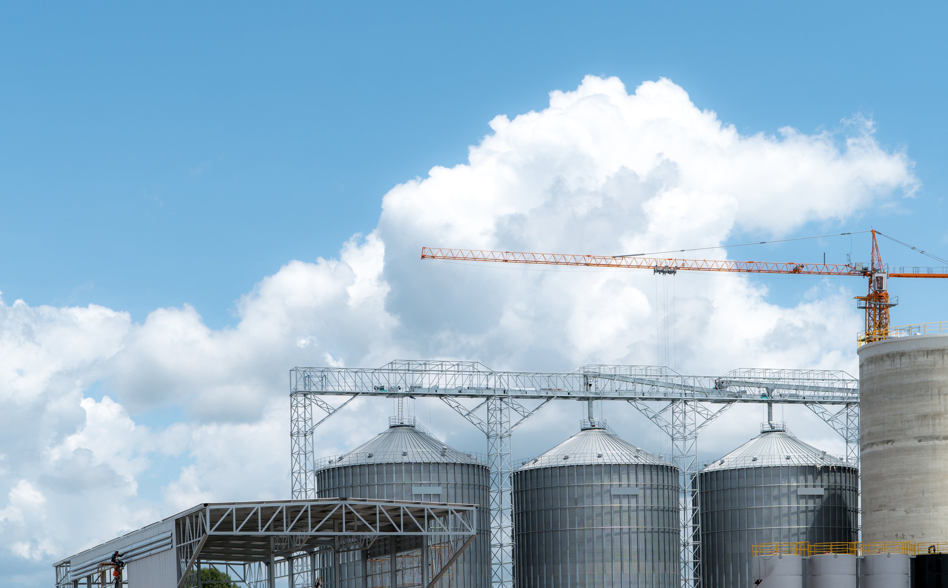 Animal feed factory construction site. Agricultural silo at feed